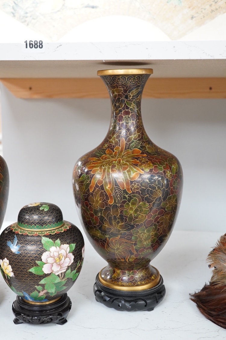 A pair of Chinese cloisonné enamel vases on stands and similar ginger jar, vases 34.6cm high including stands.